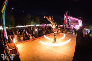 Lady Blaze spins fire hoop at Wormtown