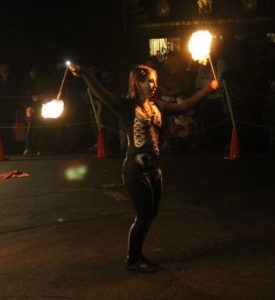 Lady Blaze spins fire poi at Beardsley zoo howl-o-ween Halloween show